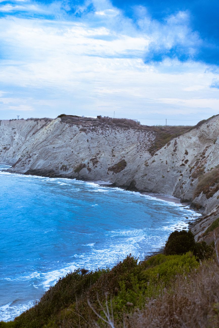 Tranquil coastal cliff and azure sea landscape